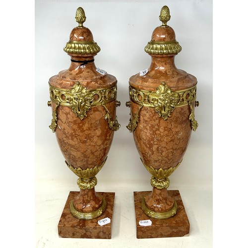 527 - A pair of French style pink onyx cassolettes, with gilt metal mounts, 56 cm high (2)