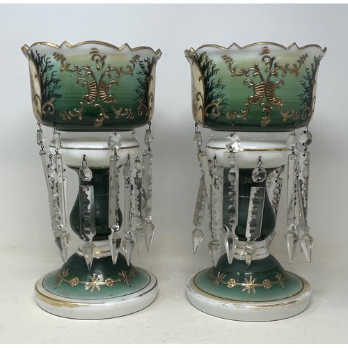 554 - A pair of glass lustres with prismatic drops, decorated children, 30 cm high (2)