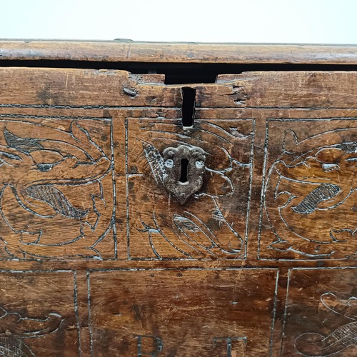 658 - An 18th century Continental carved cedarwood coffer, 130 cm wide