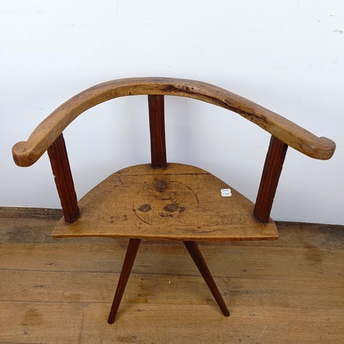 665 - A child's primitive/country made chair, of triangular form on three legs