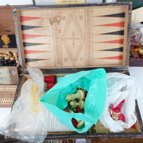 616 - A chessboard, in the form of a book, a mahogany box, assorted playing cards and game tokens (box)