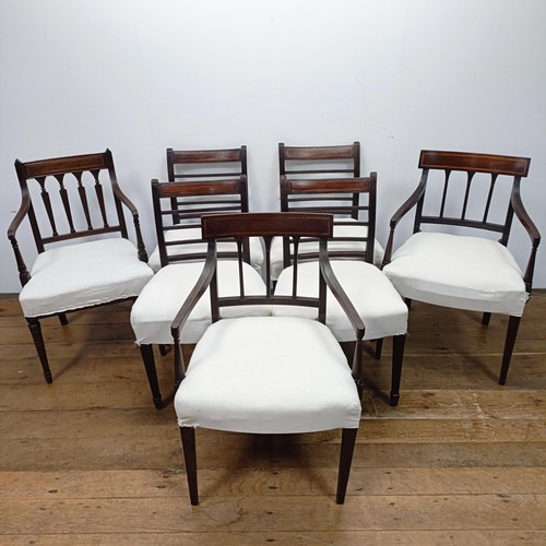 673 - A set of four mahogany rail back dining chairs, and three armchairs (7)