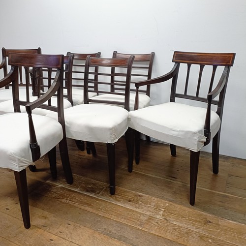 673 - A set of four mahogany rail back dining chairs, and three armchairs (7)