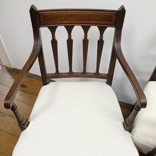 673 - A set of four mahogany rail back dining chairs, and three armchairs (7)