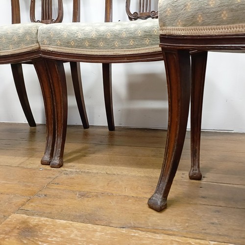 669 - A set of four mahogany dining chairs, with carved lyre backs (4)