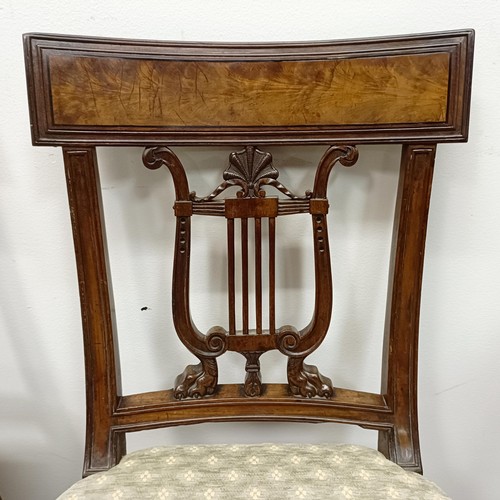 669 - A set of four mahogany dining chairs, with carved lyre backs (4)