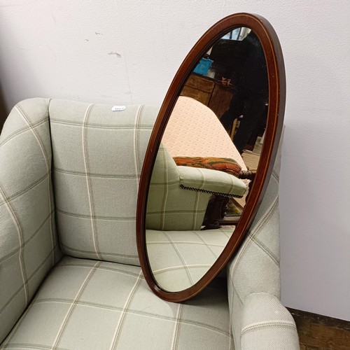 660 - A rocking chair, two armchairs, a single chair, and an oval mirror (5)