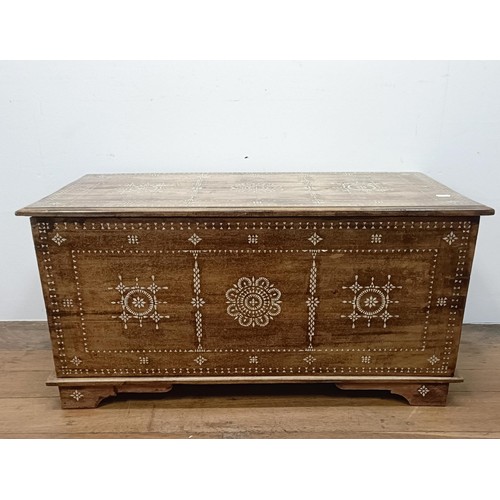 714 - A Zanzibar type trunk, 100 cm wide, a single chair, and a coffee table (3)