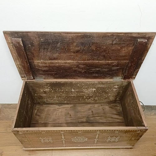 714 - A Zanzibar type trunk, 100 cm wide, a single chair, and a coffee table (3)