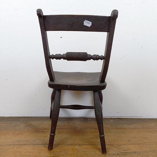 717 - A 19th century child's elm kitchen style chair