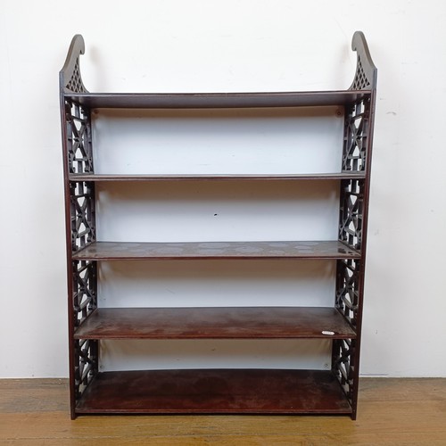 720 - A set of mahogany wall shelves, with fret carved ends, in the Chippendale manner, 105 cm high