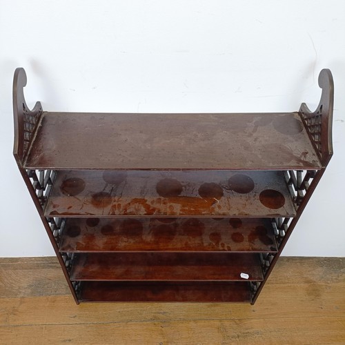 720 - A set of mahogany wall shelves, with fret carved ends, in the Chippendale manner, 105 cm high