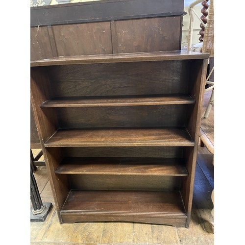 643 - An oak corner cabinet, 70 cm wide, two bookcases, a pair of bedside chests, and assorted other furni... 