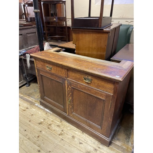 643 - An oak corner cabinet, 70 cm wide, two bookcases, a pair of bedside chests, and assorted other furni... 