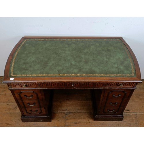 722 - A mahogany kneehole desk, with a green tooled and gilt leather top, 127 cm wide