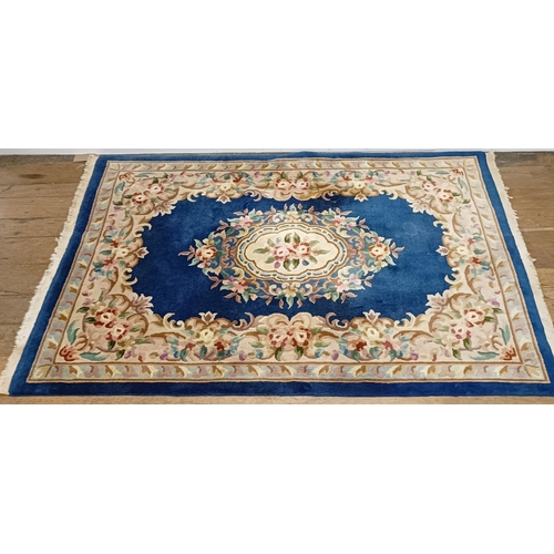 734 - A Persian type rug, 175 x 135 cm, a Chinese rug, 160 x 92 cm, and a Chinese carpet, 215 x 140 (3)