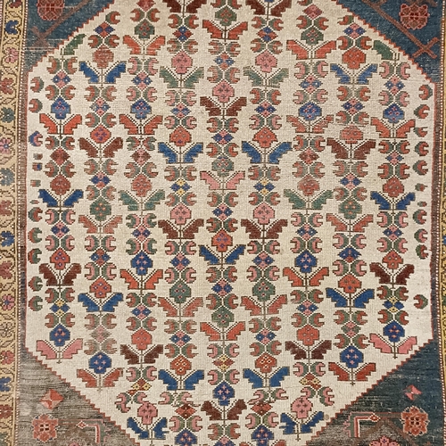 734 - A Persian type rug, 175 x 135 cm, a Chinese rug, 160 x 92 cm, and a Chinese carpet, 215 x 140 (3)