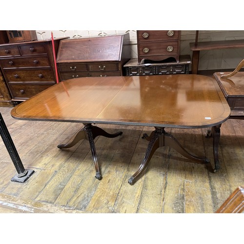 710 - A walnut lamp table, a canteen box of three drawers, a dining table and six chairs (9)