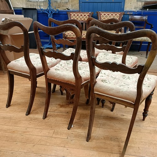 753 - A set of six mahogany balloon back dining chairs, with upholstered seats, on turned legs