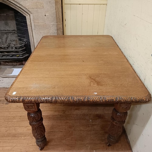 754 - An oak extending dining table, with an extra leaf, the top 112 x 107 cm