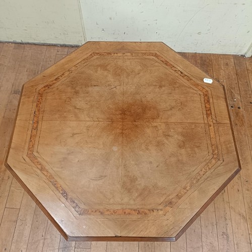 758 - A walnut lamp table, with an octagonal top, 72 cm wide