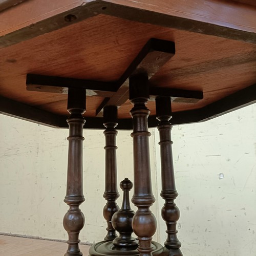 758 - A walnut lamp table, with an octagonal top, 72 cm wide