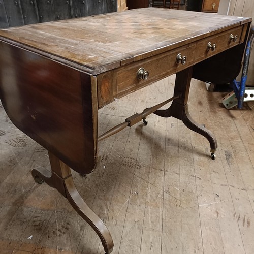 766 - A mahogany sofa table, with a reversible games top, inset with chess and backgammon board, 100 cm wi... 