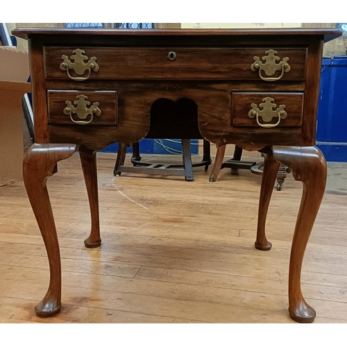 768 - A mahogany lowboy, with three drawers, on cabriole legs to pad feet, 69 cm wide