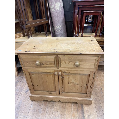 794 - A pine cupboard, 90 cm wide, a pine wine table, two wine racks, assorted pictures, an oak dresser, a... 