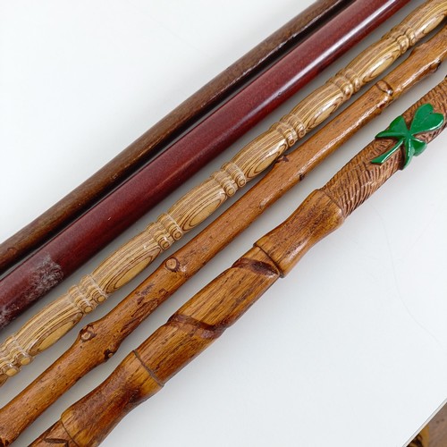 587 - A walking stick, the handle carved in the form of a dog, 38 cm, and four other walking sticks (5)