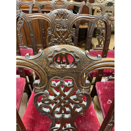 779 - A set of twelve George III style mahogany dining chairs, with pierced and carved splat backs, padded... 