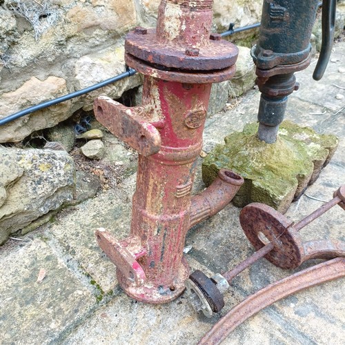 817 - A water pump on a concrete base, and another similar (2)