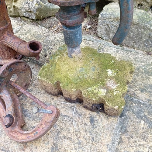 817 - A water pump on a concrete base, and another similar (2)