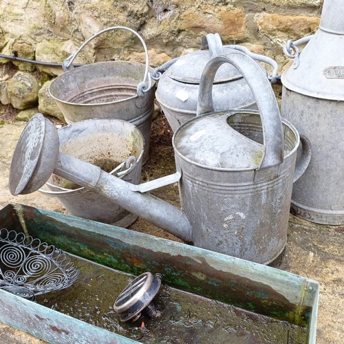 815 - A galvanized metal watering can, a bucket, a plant pot, a three gallon jug, an urn and a small troug... 