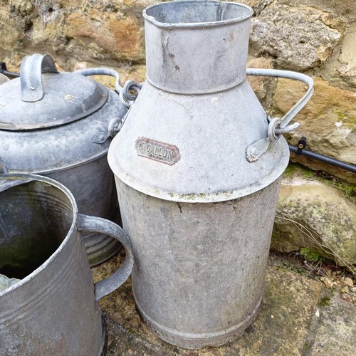 815 - A galvanized metal watering can, a bucket, a plant pot, a three gallon jug, an urn and a small troug... 