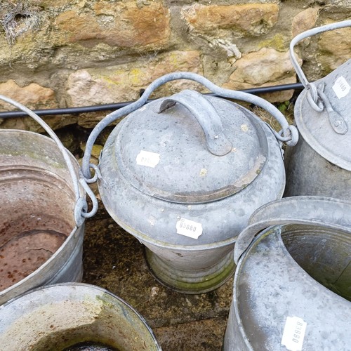 815 - A galvanized metal watering can, a bucket, a plant pot, a three gallon jug, an urn and a small troug... 