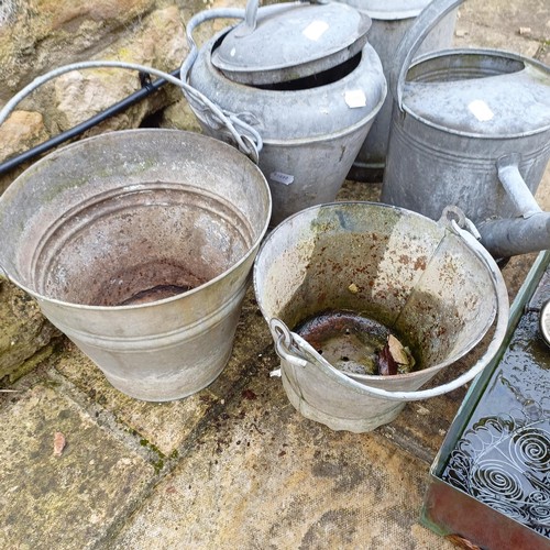 815 - A galvanized metal watering can, a bucket, a plant pot, a three gallon jug, an urn and a small troug... 