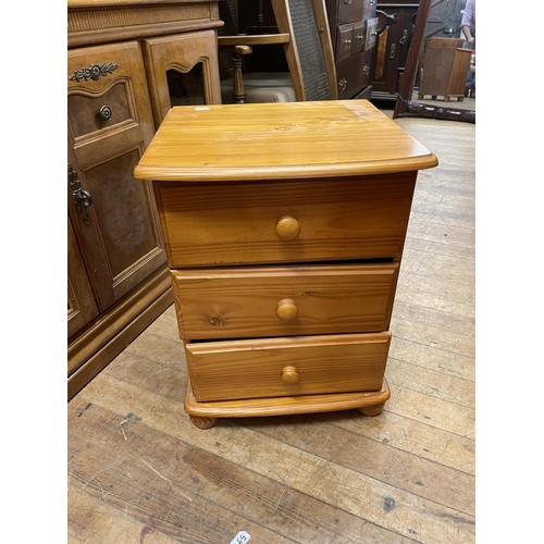 783 - A pine bookcase, 93 cm wide, a pine chest, a hi-fi unit, a walnut bedside chest, three pine bedside ... 