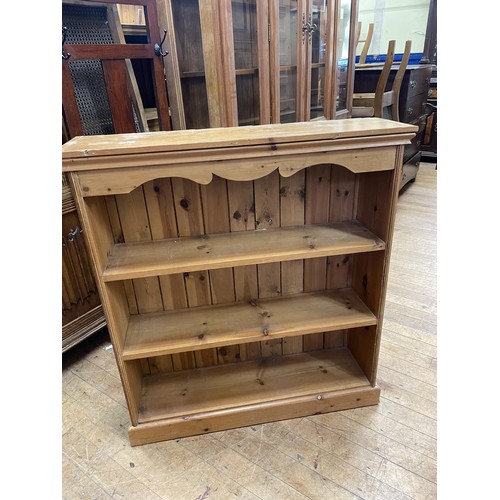 783 - A pine bookcase, 93 cm wide, a pine chest, a hi-fi unit, a walnut bedside chest, three pine bedside ... 