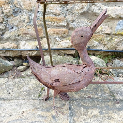 811 - A wrought iron plant stand, and a duck (2)