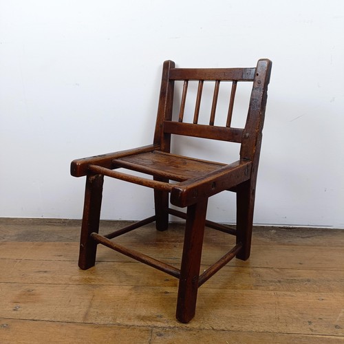 639 - A child's primitive elm chair