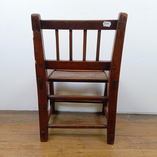 639 - A child's primitive elm chair