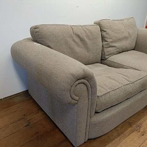 659 - A grey upholstered sofa, 210 cm