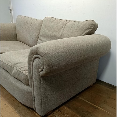 659 - A grey upholstered sofa, 210 cm