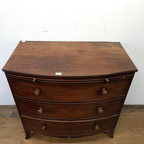 667 - A mahogany bow front chest, having a brushing slide above three drawers, 93 cm wide