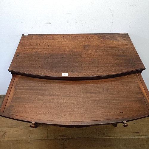 667 - A mahogany bow front chest, having a brushing slide above three drawers, 93 cm wide