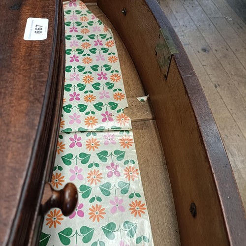 667 - A mahogany bow front chest, having a brushing slide above three drawers, 93 cm wide