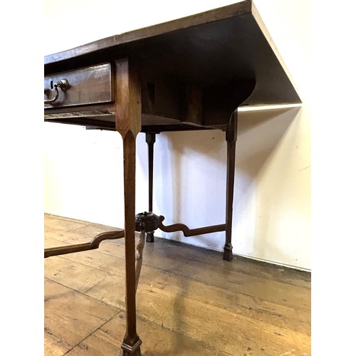 750 - A George III mahogany Pembroke table, on square chamfered legs, united by an X frame, 76 cm wide