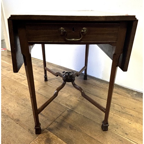 750 - A George III mahogany Pembroke table, on square chamfered legs, united by an X frame, 76 cm wide