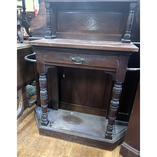 764 - A 19th century walnut hallstand, the back inset with a barometer and a mirror, 220 cm high x 100 cm ... 